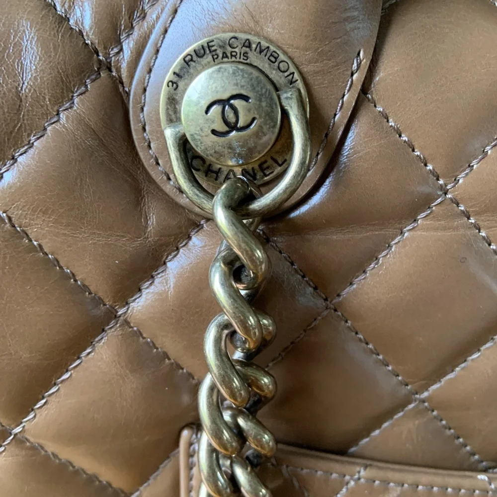 Classic brown lamb‎ skin Chanel handbag with shoulder strap